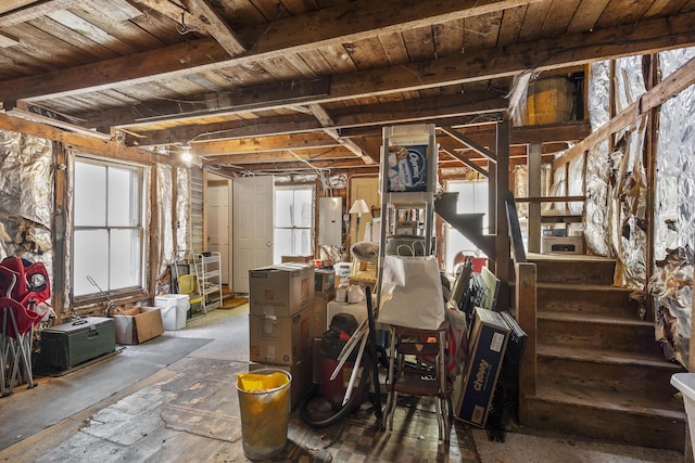 15 Winter St, Topsham, ME 04086 - below grade area with plenty of natural light, wooden ceiling, and stairway