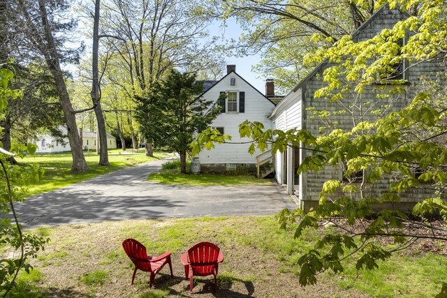 15 Winter St, Topsham, ME 04086 - view of side of property featuring a chimney