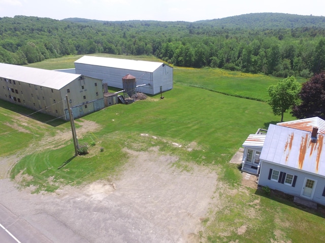 1039 Belfast Rd, Knox, ME 04986 - aerial view of property and surrounding area featuring a heavily wooded area