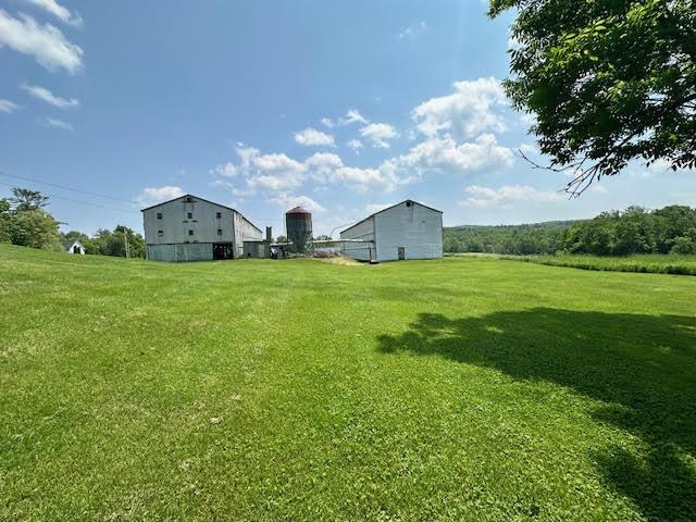 1039 Belfast Rd, Knox, ME 04986 - view of grassy yard with a barn and an outdoor structure