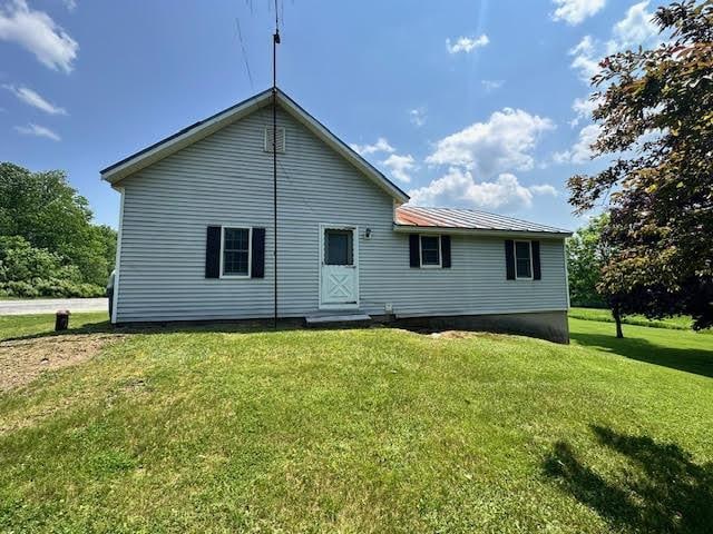 1039 Belfast Rd, Knox, ME 04986 - back of house featuring a yard and a metal roof