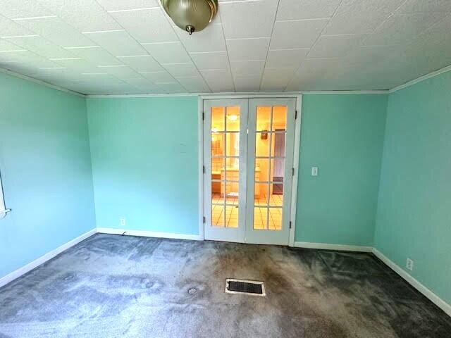 1039 Belfast Rd, Knox, ME 04986 - carpeted spare room with french doors and ornamental molding