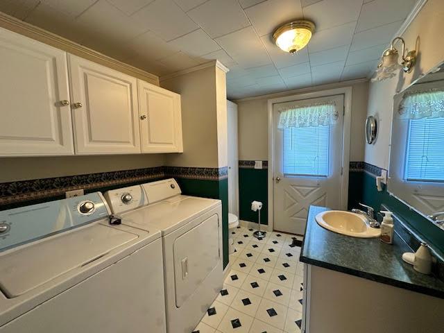1039 Belfast Rd, Knox, ME 04986 - washroom with separate washer and dryer, plenty of natural light, and wainscoting
