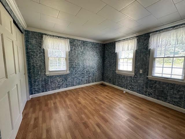 1039 Belfast Rd, Knox, ME 04986 - empty room with wood finished floors and crown molding