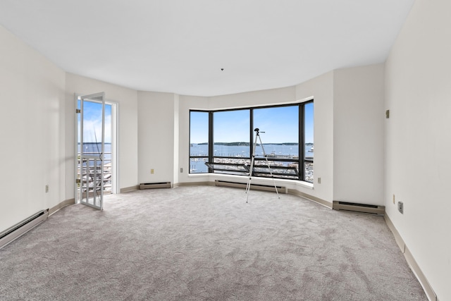 148 Breakwater Dr Unit 809, South Portland, ME 04106 - spare room featuring carpet, healthy amount of natural light, and a baseboard heating unit