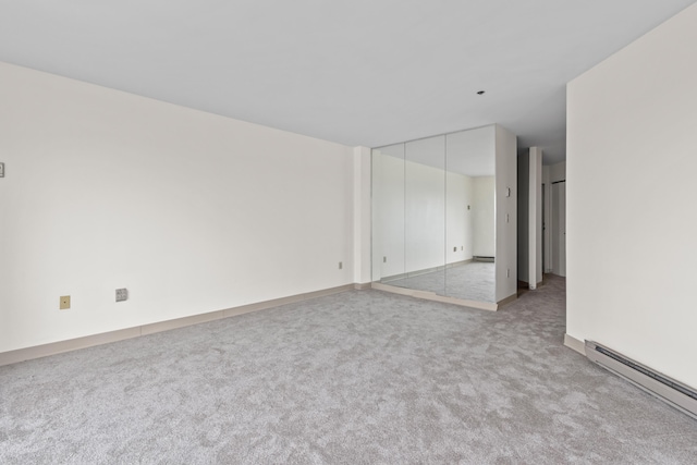 148 Breakwater Dr Unit 809, South Portland, ME 04106 - unfurnished room featuring a baseboard heating unit and carpet flooring