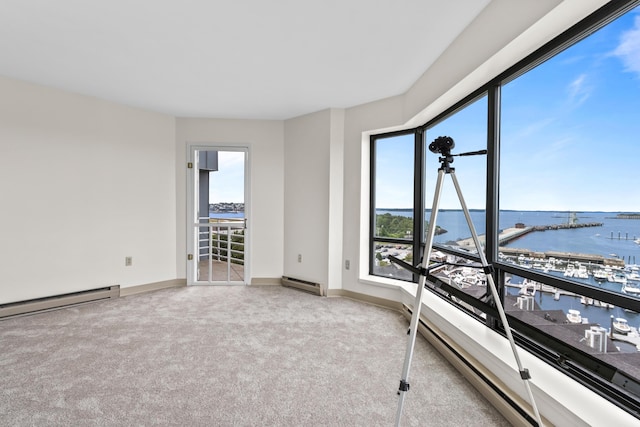 148 Breakwater Dr Unit 809, South Portland, ME 04106 - carpeted empty room featuring a water view and a baseboard heating unit