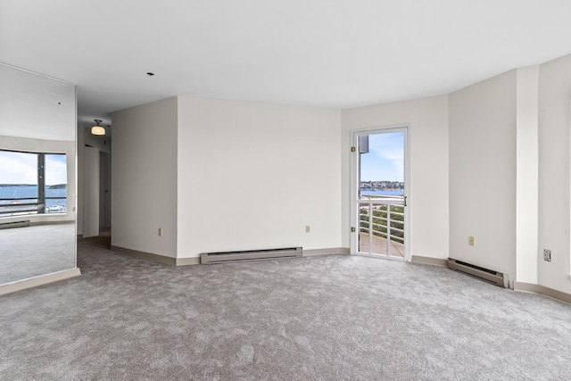 148 Breakwater Dr Unit 809, South Portland, ME 04106 - spare room featuring a baseboard radiator and carpet floors