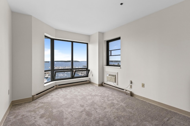 148 Breakwater Dr Unit 809, South Portland, ME 04106 - unfurnished room with baseboard heating, carpet, a water view, and a wall mounted air conditioner