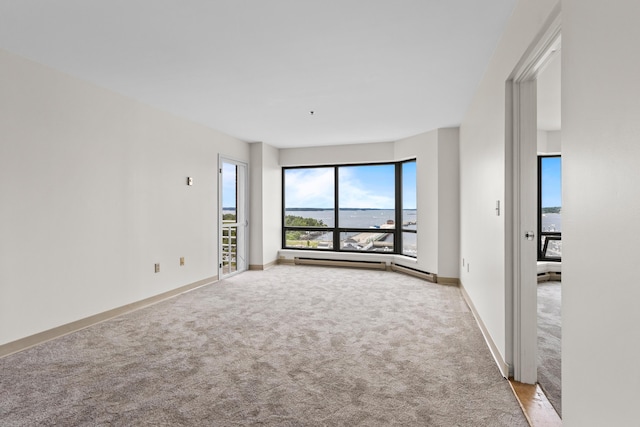 148 Breakwater Dr Unit 809, South Portland, ME 04106 - unfurnished room with light colored carpet and a baseboard radiator
