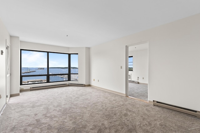 148 Breakwater Dr Unit 809, South Portland, ME 04106 - unfurnished room featuring carpet flooring, plenty of natural light, baseboard heating, and a water view