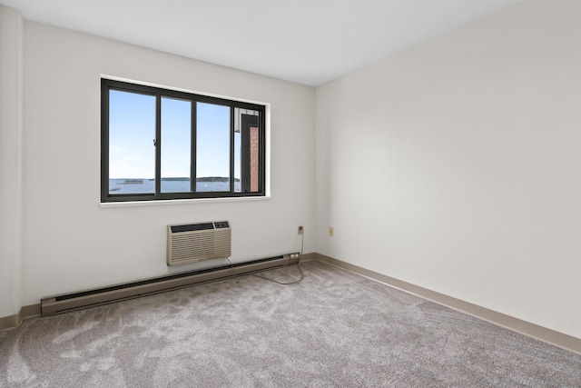 148 Breakwater Dr Unit 809, South Portland, ME 04106 - carpeted empty room featuring a baseboard heating unit and a wall unit AC