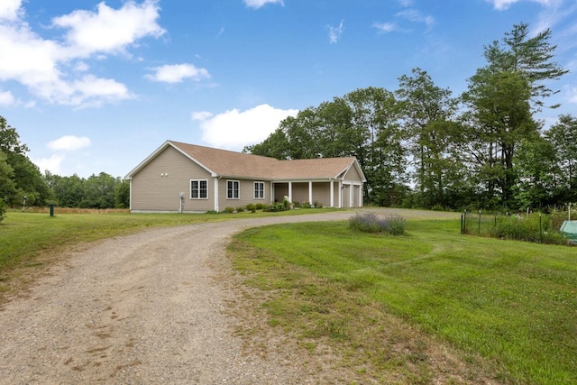29 Folly Farm Rd, Lebanon, ME 04027 - single story home with driveway, a garage, and a front lawn