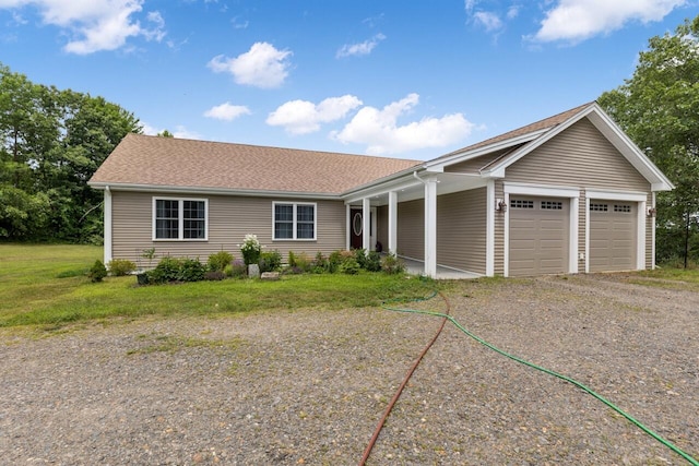 29 Folly Farm Rd, Lebanon, ME 04027 - ranch-style house with an attached garage, gravel driveway, a porch, and a shingled roof