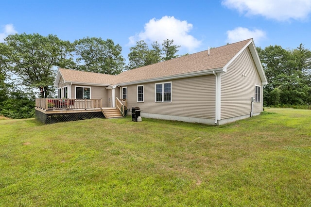 29 Folly Farm Rd, Lebanon, ME 04027 - back of house with a wooden deck, a lawn, and a shingled roof