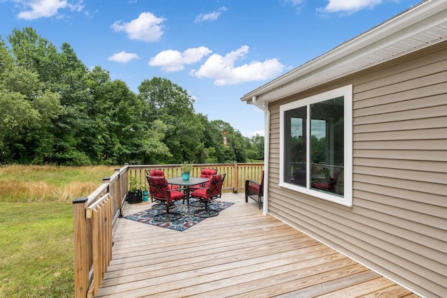 29 Folly Farm Rd, Lebanon, ME 04027 - wooden terrace with outdoor dining area and a lawn