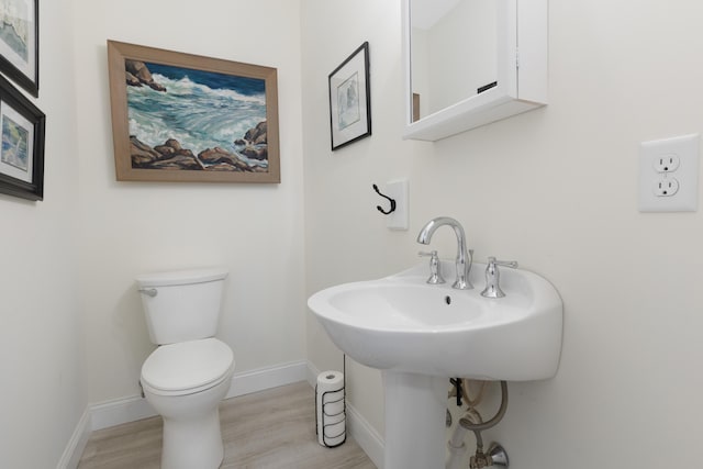 29 Folly Farm Rd, Lebanon, ME 04027 - bathroom with toilet and wood finished floors