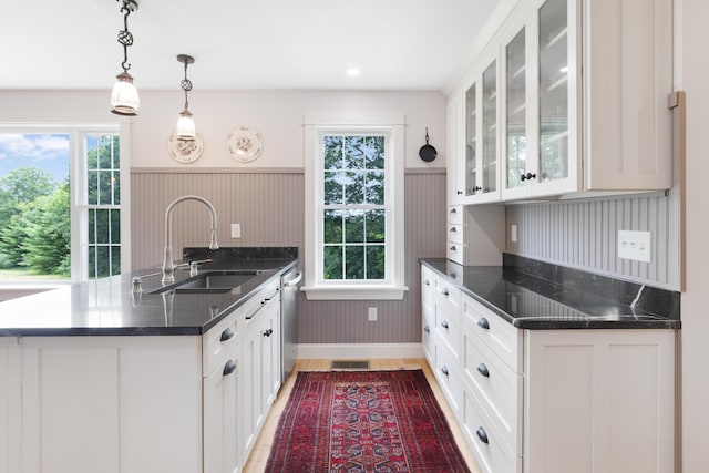 29 Folly Farm Rd, Lebanon, ME 04027 - kitchen with a peninsula, white cabinetry, glass insert cabinets, stainless steel dishwasher, and light wood-style floors