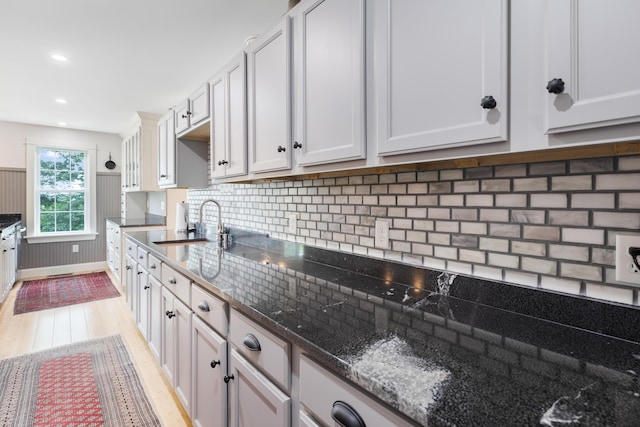 29 Folly Farm Rd, Lebanon, ME 04027 - kitchen with light wood-style floors, dark stone counters, decorative backsplash, and recessed lighting