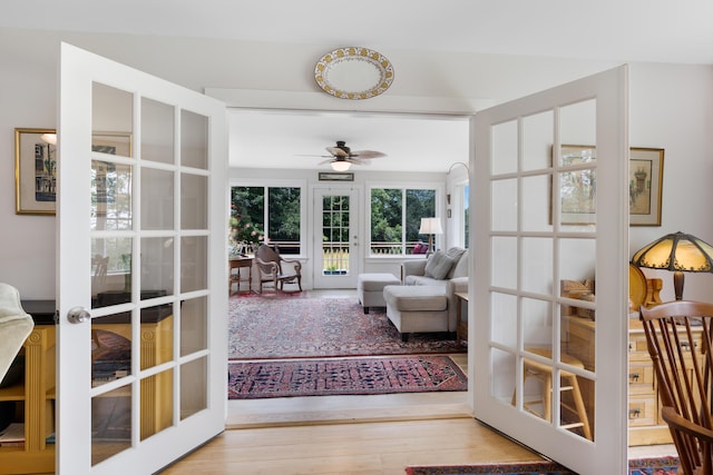 29 Folly Farm Rd, Lebanon, ME 04027 - sitting room with french doors, wood finished floors, and a ceiling fan