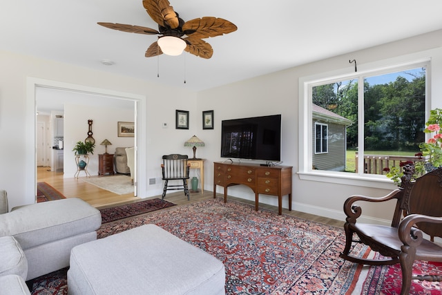 29 Folly Farm Rd, Lebanon, ME 04027 - living area with ceiling fan and wood finished floors