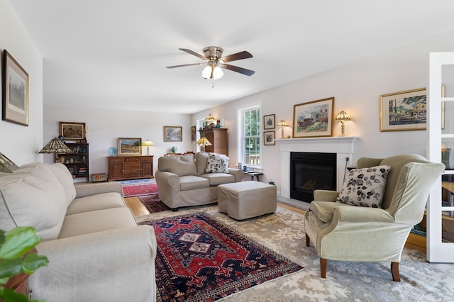 29 Folly Farm Rd, Lebanon, ME 04027 - living room with ceiling fan, a glass covered fireplace, and wood finished floors