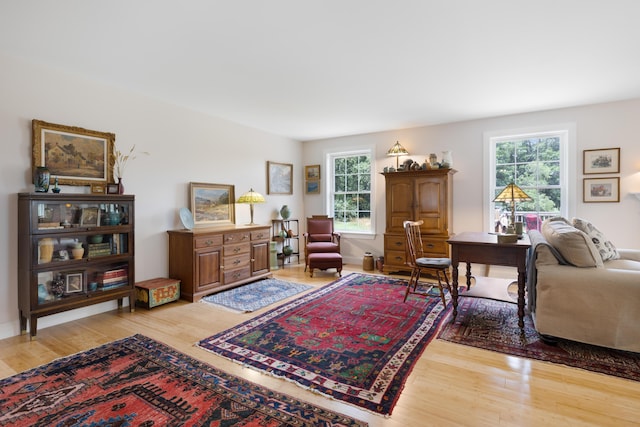 29 Folly Farm Rd, Lebanon, ME 04027 - living area featuring healthy amount of natural light and wood finished floors