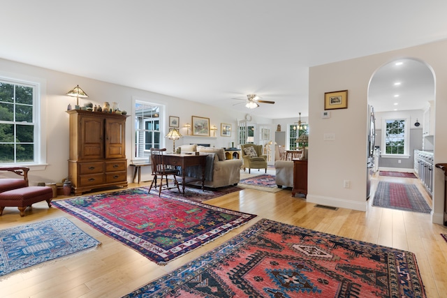 29 Folly Farm Rd, Lebanon, ME 04027 - living room with light wood-type flooring, ceiling fan, and arched walkways
