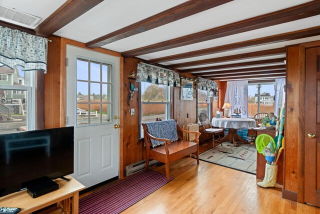 428 Eldridge Rd, Wells, ME 04090 - sunroom featuring beam ceiling, a baseboard radiator, and plenty of natural light