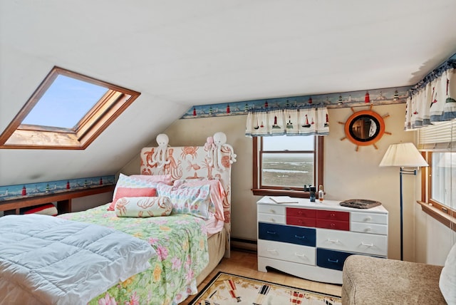 428 Eldridge Rd, Wells, ME 04090 - bedroom with lofted ceiling, multiple windows, and a skylight