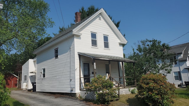 236 Birch St, Bangor, ME 04401 - view of front of property featuring a porch and a chimney