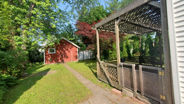 236 Birch St, Bangor, ME 04401 - view of grassy yard featuring a pergola and a storage shed