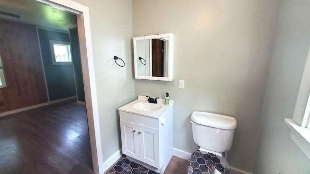 236 Birch St, Bangor, ME 04401 - half bathroom with vanity and wood finished floors