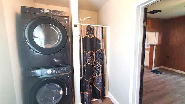 236 Birch St, Bangor, ME 04401 - laundry room featuring estacked washer and dryer and wood finished floors
