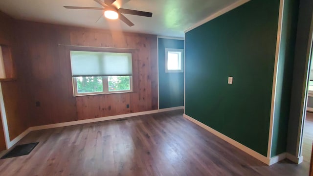236 Birch St, Bangor, ME 04401 - empty room with a ceiling fan and wood finished floors