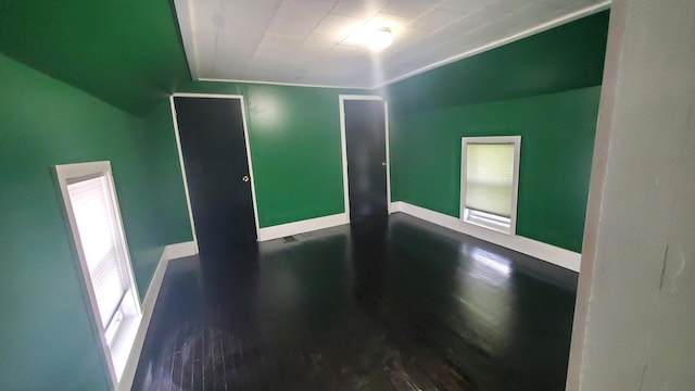 236 Birch St, Bangor, ME 04401 - spare room with wood finished floors and vaulted ceiling