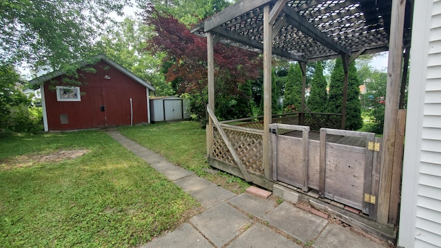 236 Birch St, Bangor, ME 04401 - view of green lawn with a storage shed and a pergola