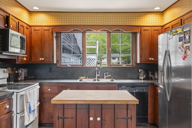 14 Lakeshore Dr, Belgrade, ME 04918 - kitchen featuring appliances with stainless steel finishes, wooden counters, a center island, brown cabinets, and decorative backsplash