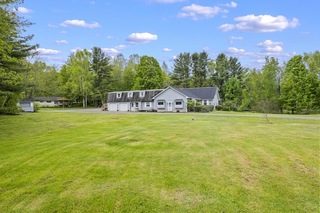 14 Lakeshore Dr, Belgrade, ME 04918 - view of front facade featuring a front lawn and a garage