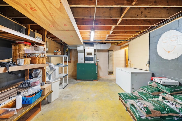 11 Ridgewood Dr, Lebanon, ME 04027 - unfinished below grade area featuring white fridge and concrete block wall