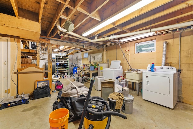 11 Ridgewood Dr, Lebanon, ME 04027 - basement featuring washing machine and clothes dryer, water heater, and concrete block wall