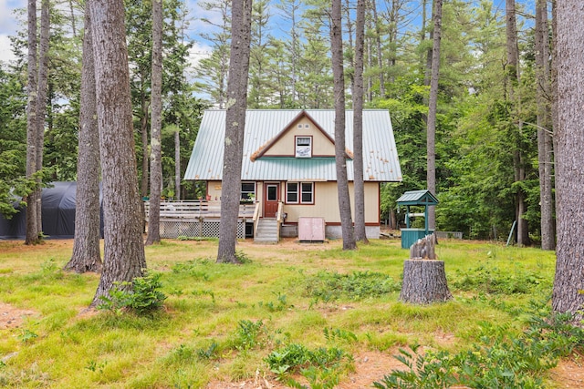 11 Ridgewood Dr, Lebanon, ME 04027 - view of front of house featuring a wooden deck and a metal roof