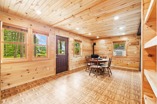11 Ridgewood Dr, Lebanon, ME 04027 - dining space with wooden ceiling, recessed lighting, cooling unit, plenty of natural light, and a wood stove