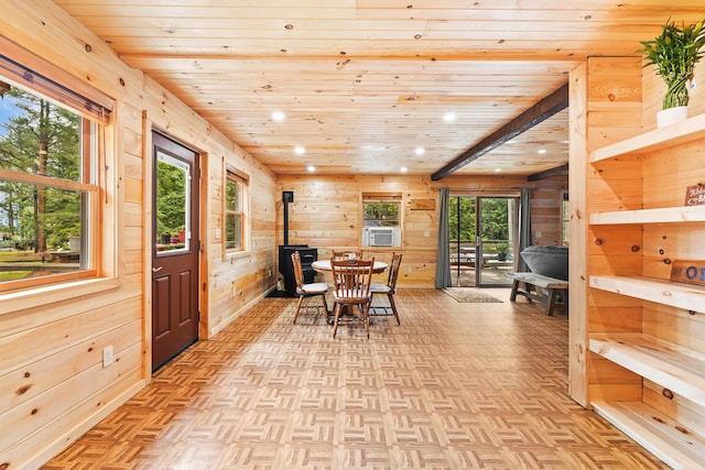 11 Ridgewood Dr, Lebanon, ME 04027 - dining space with a wood stove, wooden ceiling, wooden walls, recessed lighting, and cooling unit