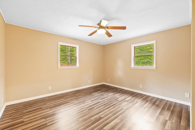 11 Ridgewood Dr, Lebanon, ME 04027 - spare room featuring healthy amount of natural light, wood finished floors, a ceiling fan, and crown molding
