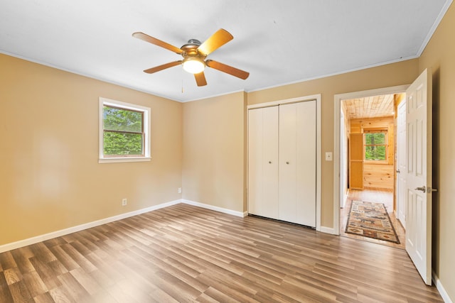 11 Ridgewood Dr, Lebanon, ME 04027 - unfurnished bedroom featuring light wood-type flooring, ornamental molding, a closet, and a ceiling fan