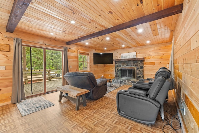 11 Ridgewood Dr, Lebanon, ME 04027 - living room with wood walls, recessed lighting, a stone fireplace, and a wood ceiling with exposed beams
