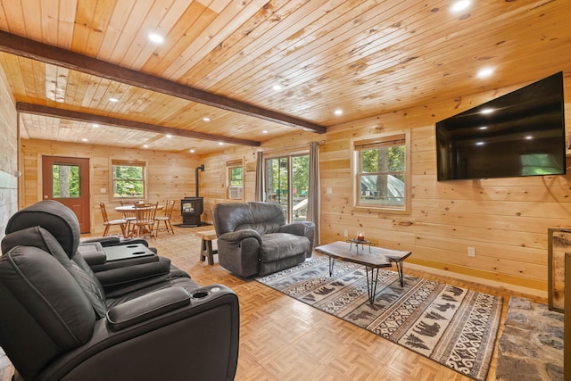 11 Ridgewood Dr, Lebanon, ME 04027 - living area featuring a wood stove, recessed lighting, wooden walls, a wood ceiling with exposed beams, and parquet flooring
