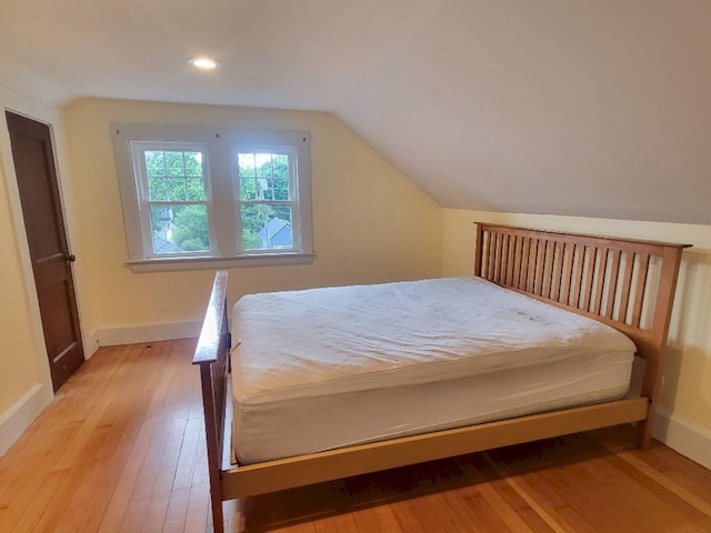 12 Allen St, Wilton, ME 04294 - bedroom featuring light wood-type flooring, vaulted ceiling, and recessed lighting