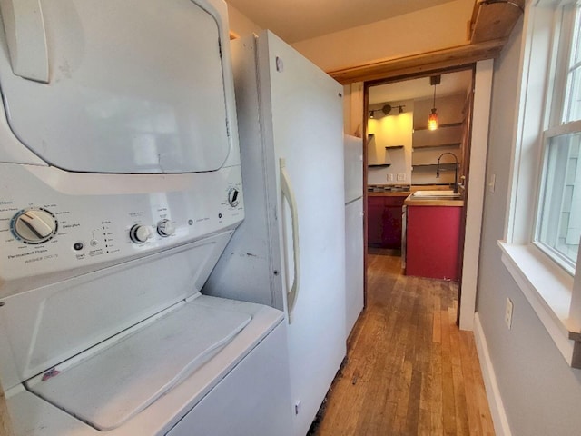 12 Allen St, Wilton, ME 04294 - washroom with stacked washer / drying machine and wood finished floors